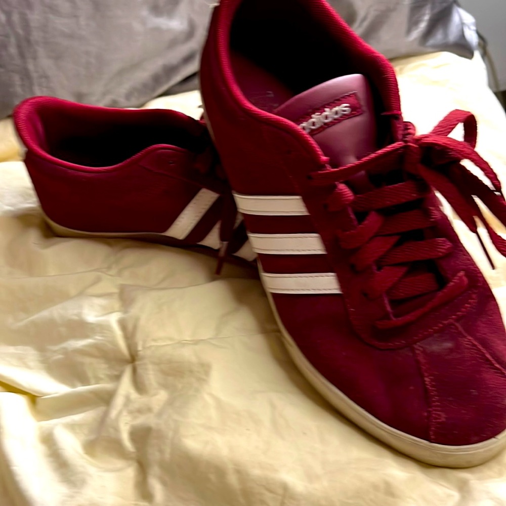 Red suede Adidas tennis shoes